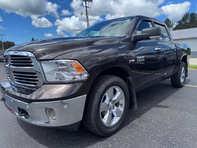 2017 RAM 1500 Big Horn in Brown — front three-quarter view